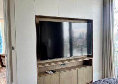 Modern bedroom with built-in entertainment unit