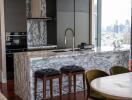 Modern kitchen with marble countertops and city view