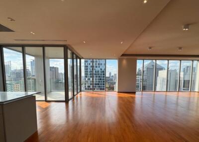 spacious living room with city view and wooden floor