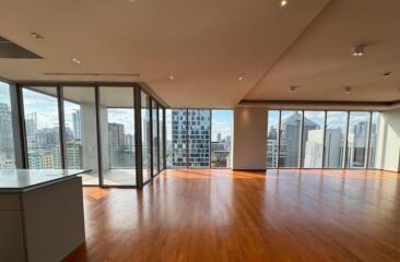 spacious living room with city view and wooden floor