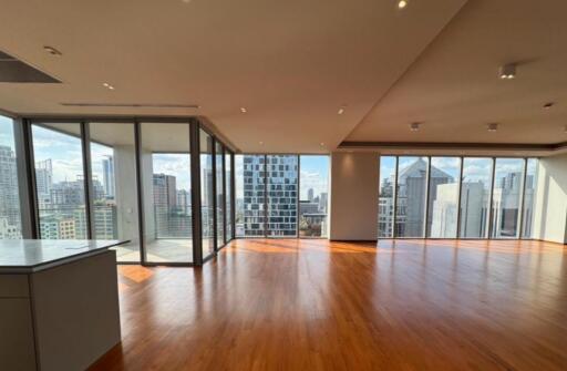 spacious living room with city view and wooden floor