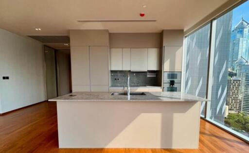 Modern kitchen with island and large windows