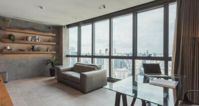 Modern living room with city view and large windows