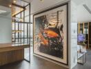 Modern living area with a large fish artwork, wooden and metal accents