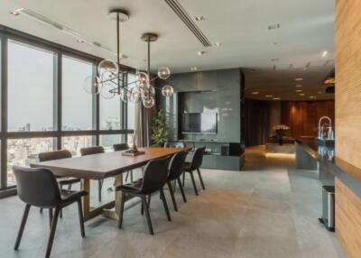 Modern dining area with large windows and city view