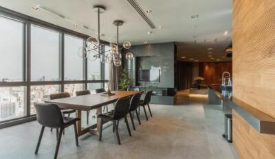 Modern dining area with large windows and city view