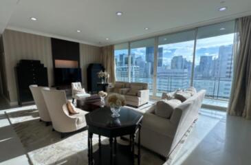 Living room with large windows and city view