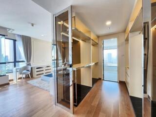 Modern bedroom with ample natural light and a walk-in closet