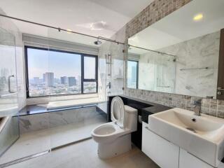 Modern bathroom with large window and city view