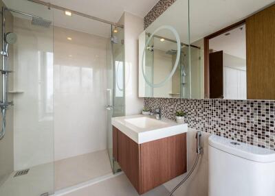 Modern bathroom with glass shower and floating vanity