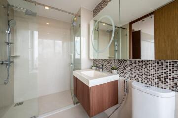 Modern bathroom with glass shower and floating vanity