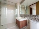 Modern bathroom with glass shower and floating vanity