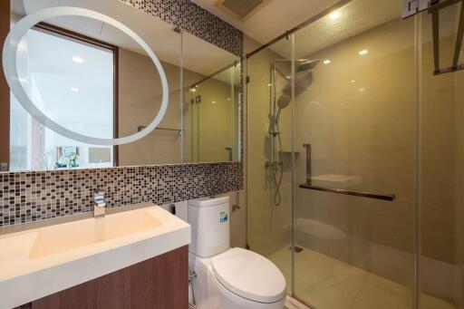 Modern bathroom with glass-enclosed shower and vanity