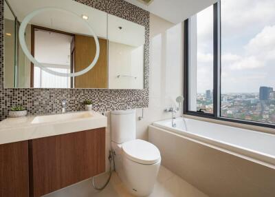 Modern bathroom with large window and city view