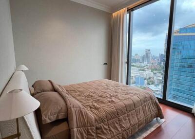 High-rise apartment bedroom with city view