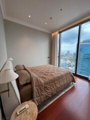 High-rise apartment bedroom with city view