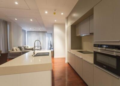 Modern kitchen with island and adjacent living area