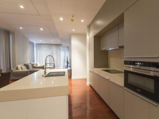 Modern kitchen with island and adjacent living area