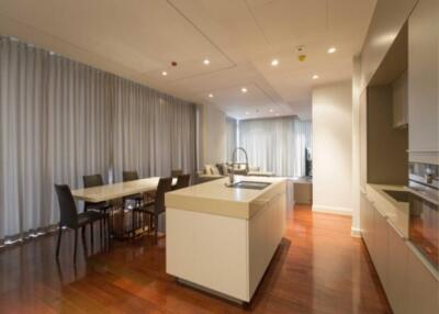 Modern kitchen and dining area with island and wooden floor