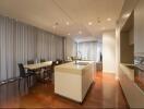 Modern kitchen and dining area with island and wooden floor