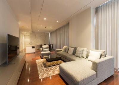 Modern living room with sectional sofa and large TV