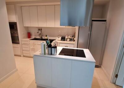 Modern kitchen with white cabinetry and an island