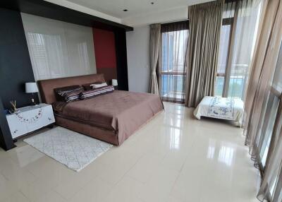 Modern bedroom with large windows and natural light