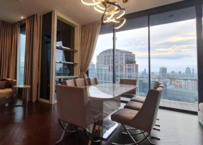 Dining area with large windows and city view