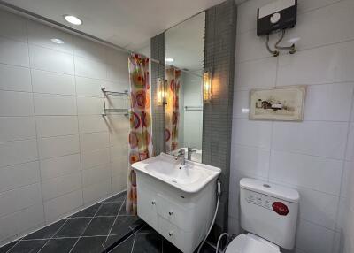 Bathroom with sink, toilet, and shower