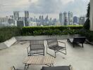 Scenic view of city from outdoor terrace with seating