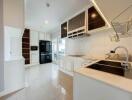 Modern kitchen with white cabinets and stainless steel appliances