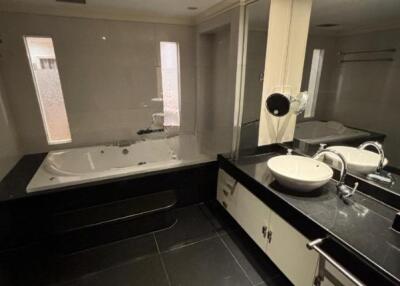 Modern bathroom with jacuzzi tub and twin sinks