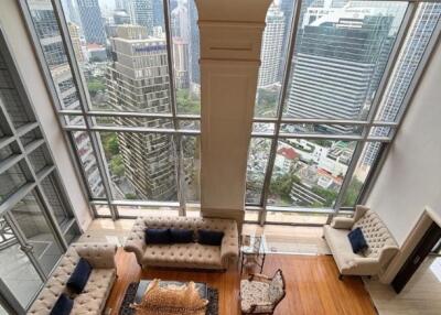 Luxury high-rise living room with large windows and city views