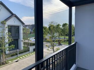 View from the balcony overlooking neighborhood and greenery