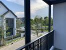 View from the balcony overlooking neighborhood and greenery