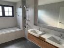 Modern bathroom with double sinks and a bathtub