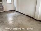 Empty living room with concrete floor