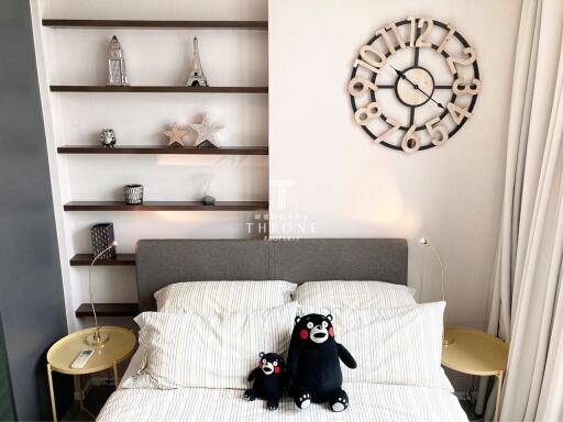 Modern bedroom with shelves and decorative wall clock