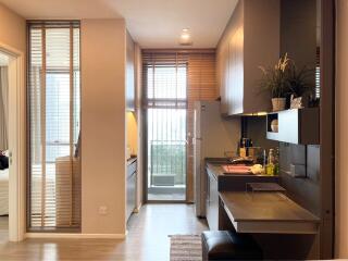 modern kitchen with sleek cabinets and an adjacent dining area