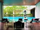 Modern outdoor pool area with lounge chairs