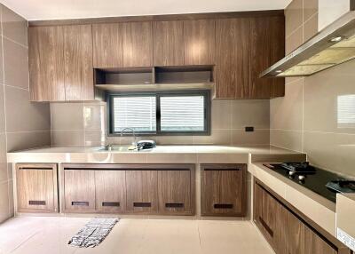 Modern kitchen with wooden cabinets and countertop