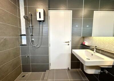 Modern bathroom with shower and white sink