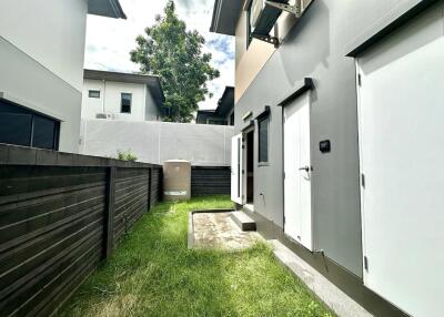 Exterior view of backyard and side of house