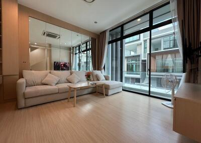 Modern living room with large windows and neutral decor