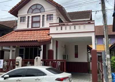 Two-story house with a covered carport