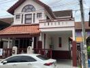 Two-story house with a covered carport