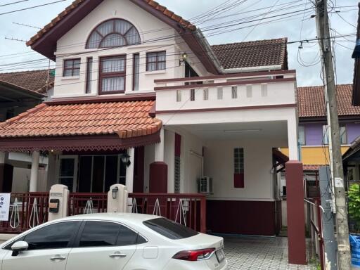 Two-story house with a covered carport