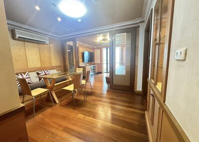 Modern dining room with wooden floors and glass partition