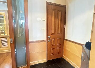 Entryway with wooden door