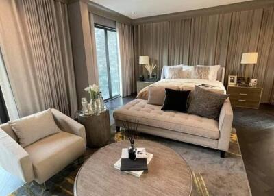 Modern bedroom with seating area and sophisticated decor